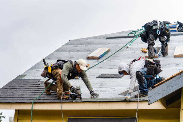 Professional Storm Damage Roof Repair technician working in Greenfield Park, NY